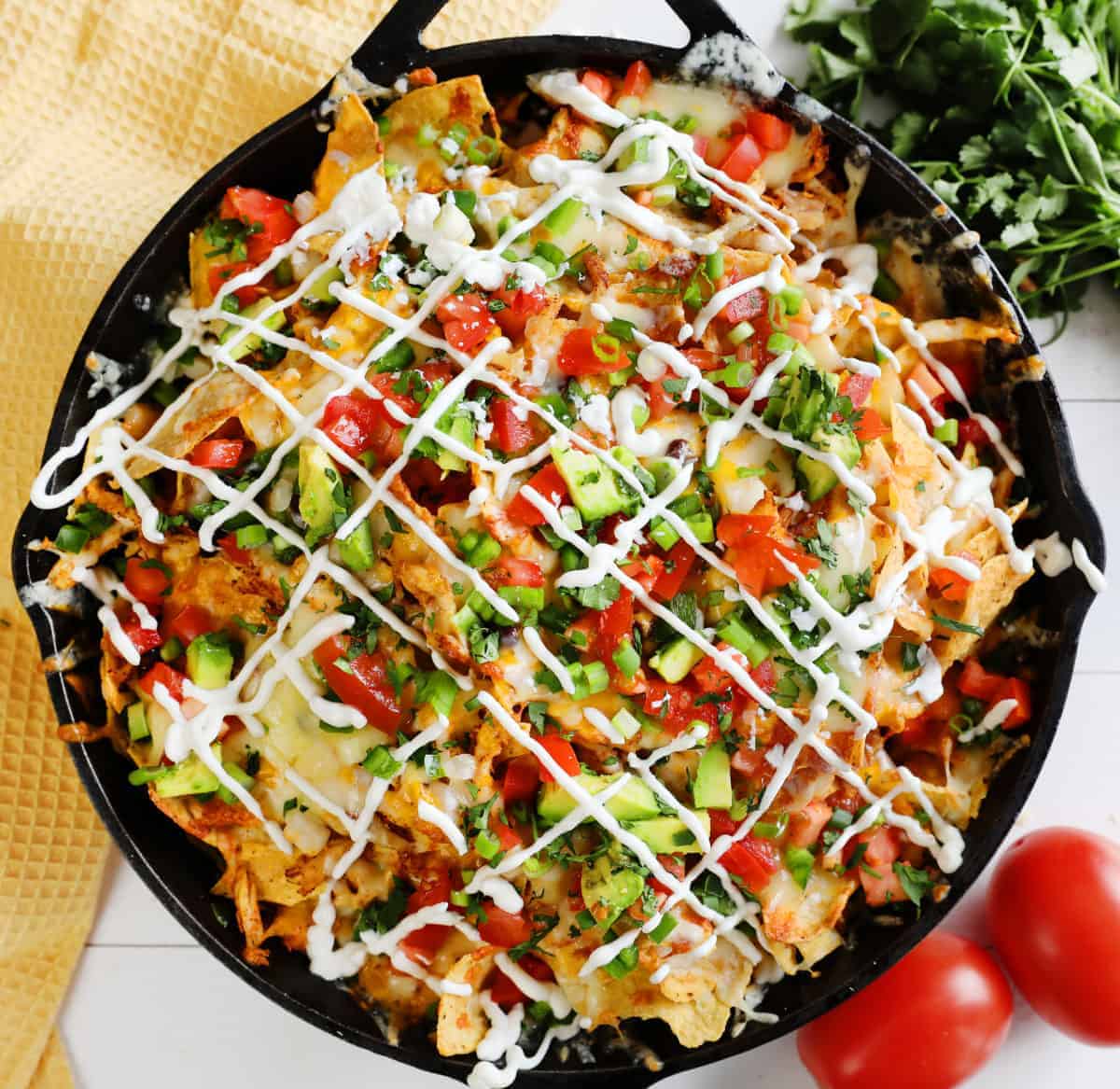 Skillet Chicken Nachos are the BEST way to enjoy nachos at home! Better than any restaurant! #nachos #chickennachos #howtomakenachos #skilletnoachos #easychickennachos #iambaker Loaded Chicken Nachos