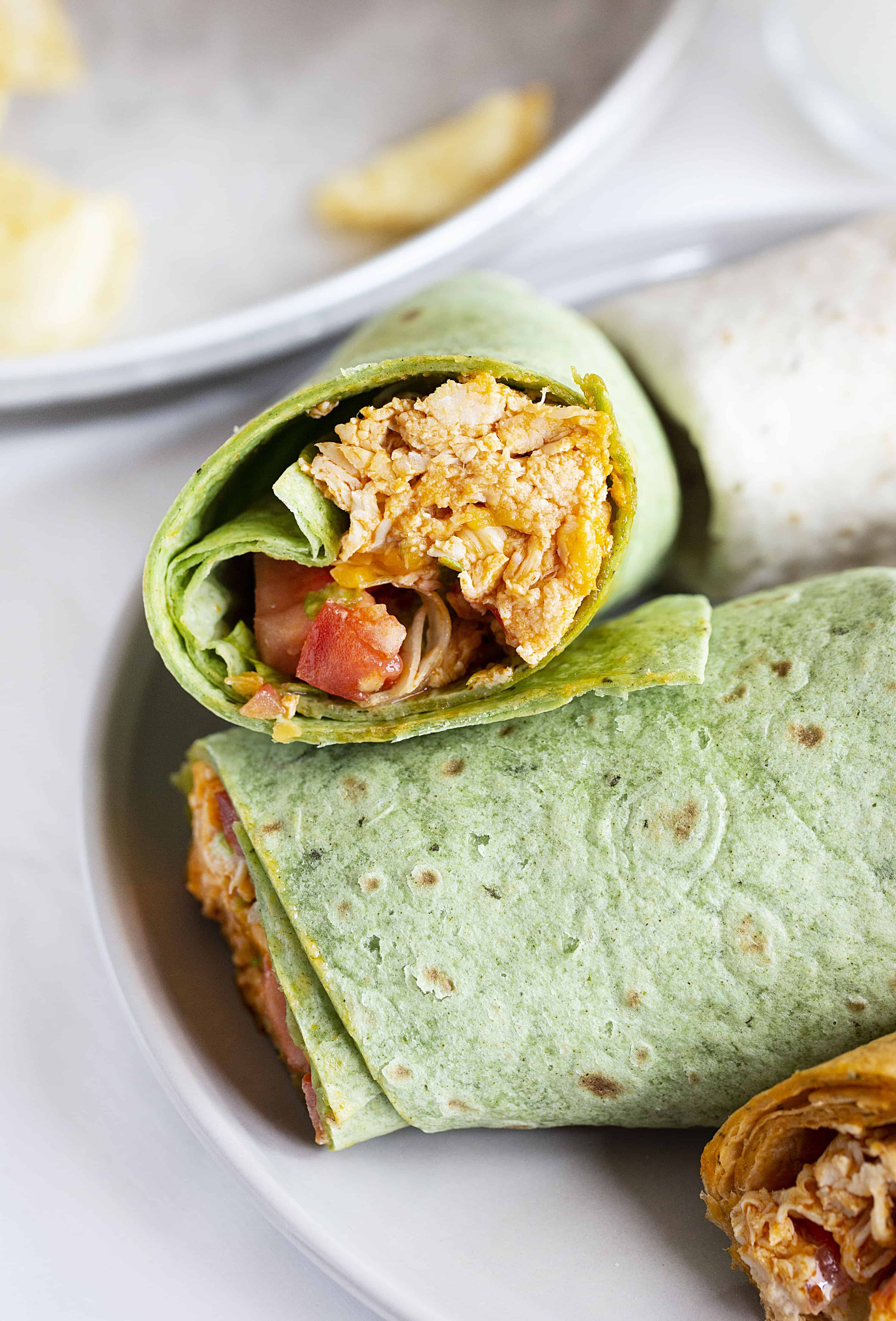 Buffalo Chicken Wraps are a quick and easy lunch or dinner meal! buffalo sauce, buffalo chicken, buffalo chicken wraps, wrap recipes, chicken wraps, rotisserie chicken, chicken recipes, iambaker 布法罗鸡肉卷