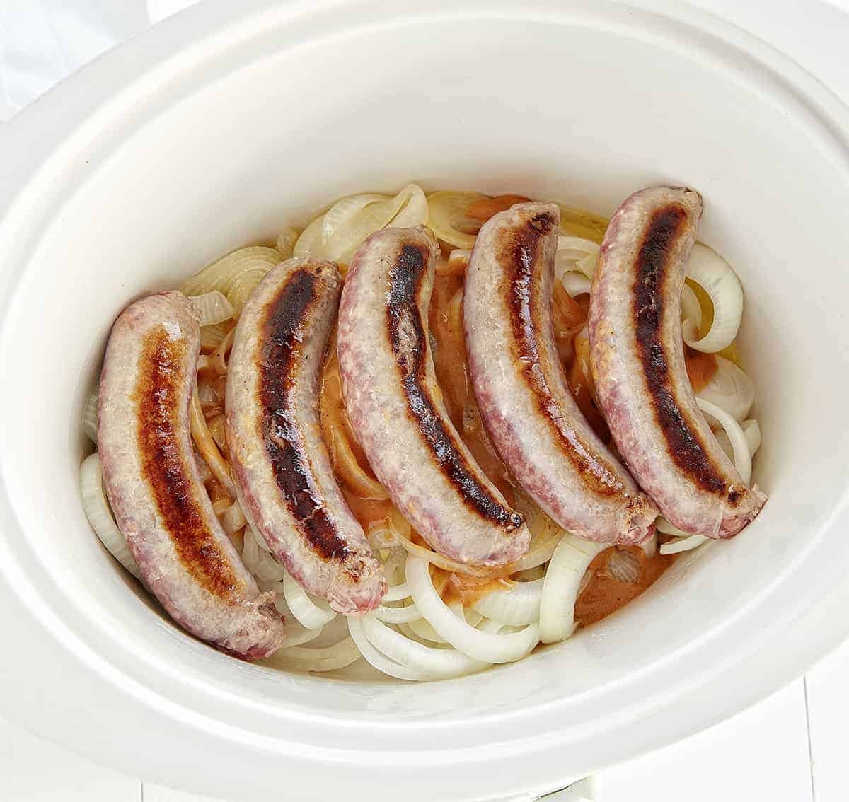 Get your summer off to the best start with slow cooker brats and marinated onions! #slowcooker #slowcookermeals #slowcookerrecipes #slowcookersummermeals #slowcookersummerrecipes #Bratwursts #slowcookerbrats #beerbrats #slowcookerbeerbrats #brats #summermeals #iambaker #labordayfoodideas #recipes 烹饪之前慢炖锅啤酒小鬼褐色gydF4y2Ba