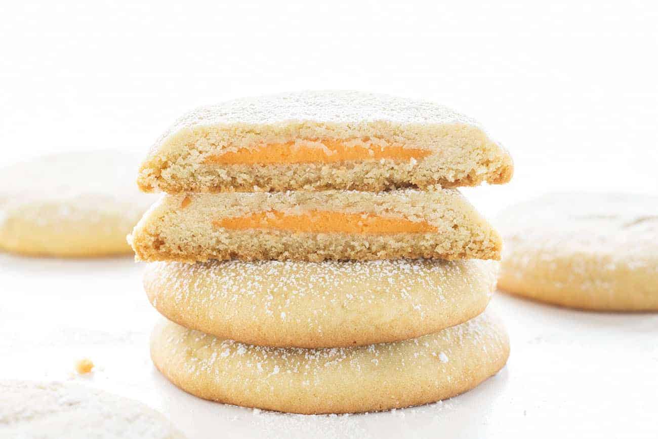 These Orange Cheesecake Sugar Cookies taste like a creamsicle cookie! Such a fun surprise inside! Orange Cookie, Amish Sugar Cookie, Sugar Cookie, How to Make Stuffed Cookies, Stuffed Cookies, Orange Cheesecake Filled Sugar Cookie, Easy Sugar Cookie, How to Make Stuffed Cookie Recipes, i am baker, Baking, Recipes, Dessert 橙色Creamsicle塞糖饼干切开