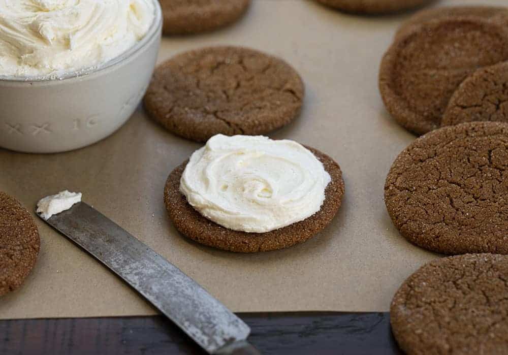 A Ginger Sandwich Cookie is light and fluffy marshmallow buttercream sandwiched between two soft and chewy homemade ginger cookies. Ginger Cookies, Ginger Sandwich Cookies, Ginger Cookie Sandwich, Marshmallow Buttercream, Baking, Cookies, Dessert, Holiday, Christmas Cookies, i am baker, iambaker 制作姜味曲奇三明治