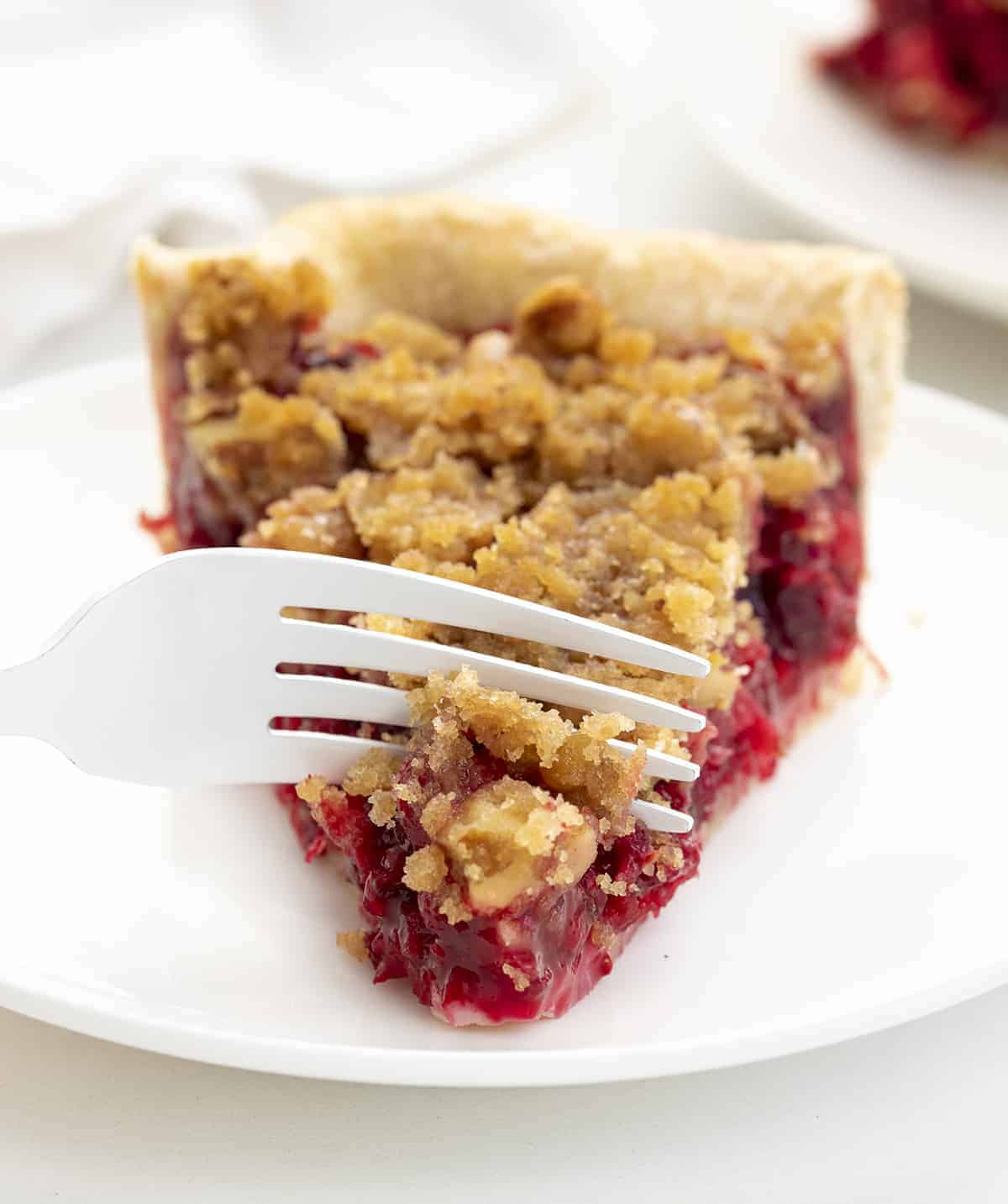 Fork Cutting into Cranberry Pie